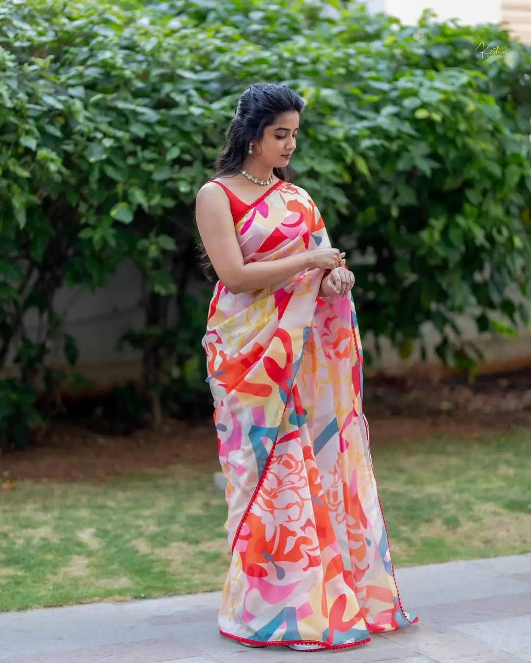 Indian Actress Gouri Priya Photoshoot in Red Saree Sleeveless Blouse